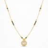 Gold plated mangalsutra necklace with black beads and geometric crystal studded pendant on a delicate chain.