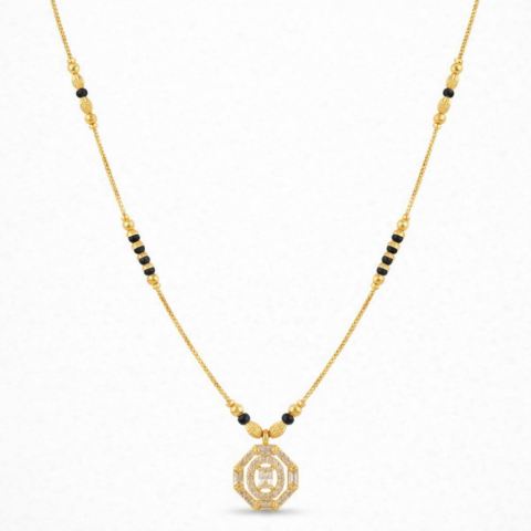 Gold plated mangalsutra necklace with black beads and geometric crystal studded pendant on a delicate chain.