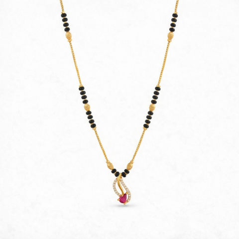 Gold plated mangalsutra necklace with black beads and swirl pendant featuring a ruby red stone and crystal accents.