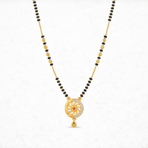 Gold plated mangalsutra necklace with black beads and sunburst circular pendant featuring crystal accents and a ruby center stone.