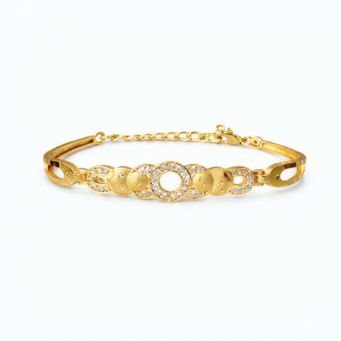 Gold plated bracelet with circular crystal studded design and polished gold discs on white background.