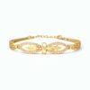 Infinity gold bracelet for women with crystal studded design and elegant gold plated finish on white background.