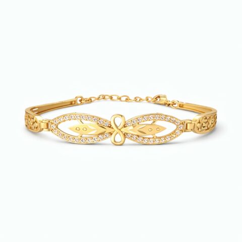 Infinity gold bracelet for women with crystal studded design and elegant gold plated finish on white background.