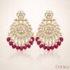 Elegant kundan chandbali earrings with intricate stone work and bead drops